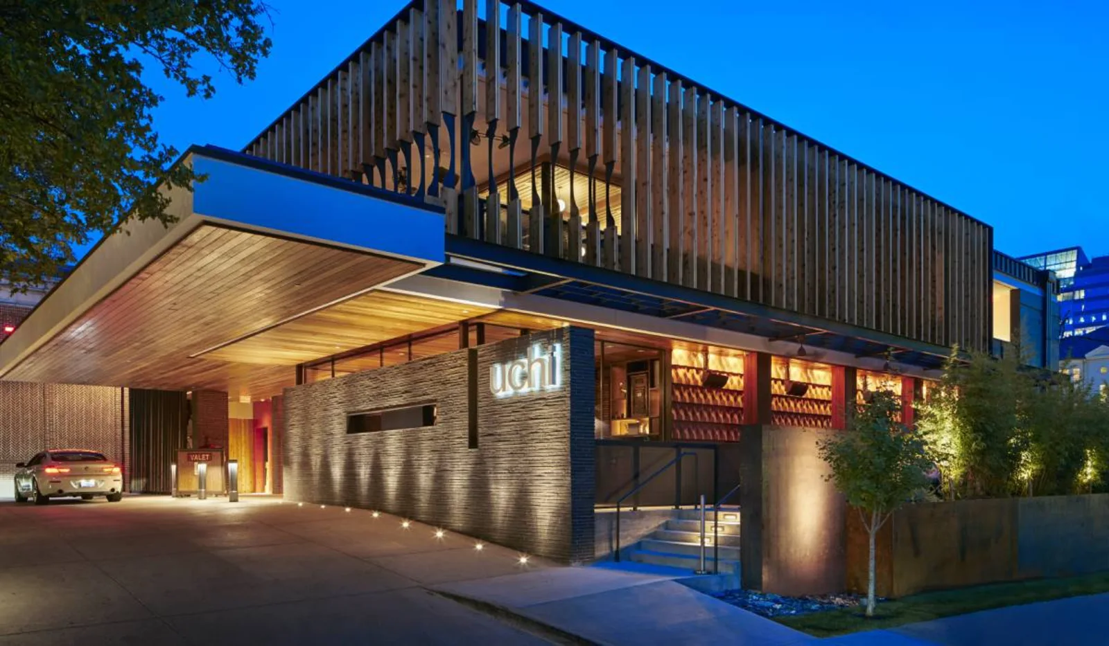 Uchi restaurant exterior at dusk &mdash; Hai Hospitality's flagship concept