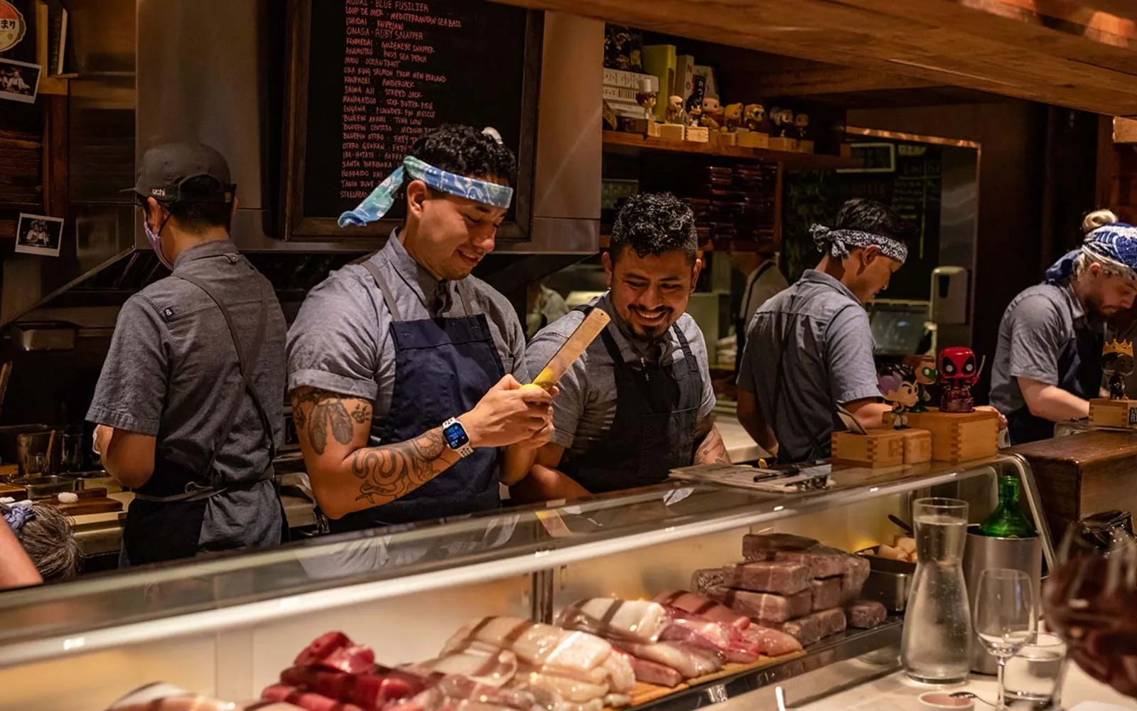 Chefs working the sushi bar at Uchi &mdash; Hai Hospitality's flagship concept