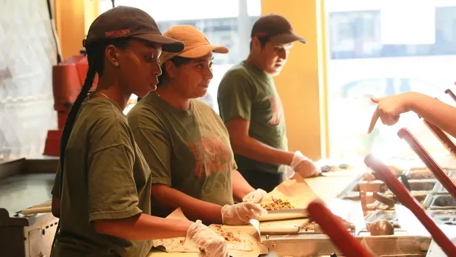 Pancheros team member working the line