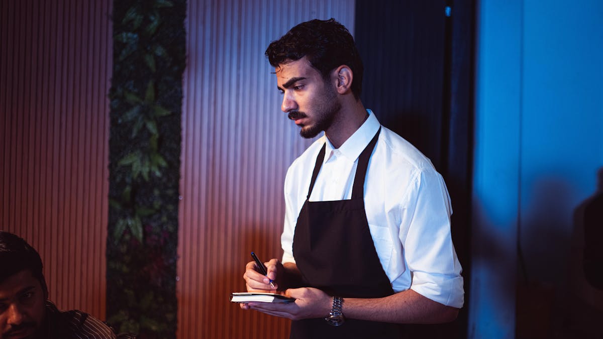 Restaurant waiter taking an order